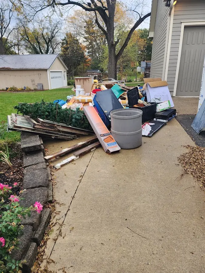 Dumpster being loaded with debris for Commercial Dumpster Rental in Rittman